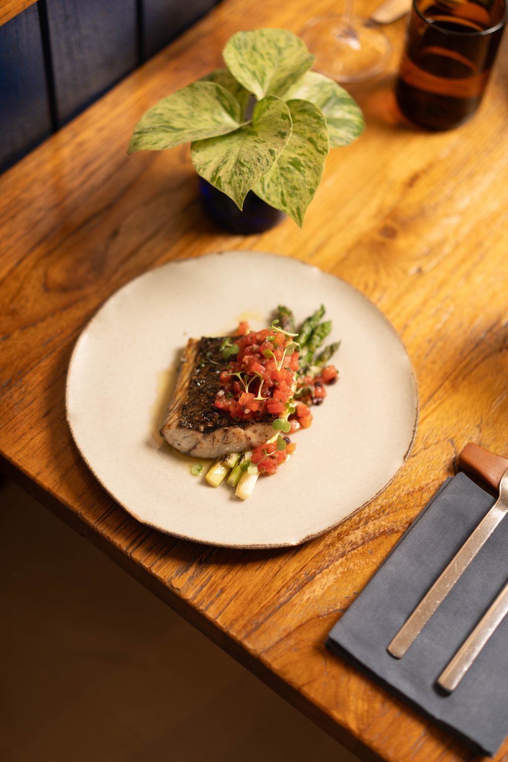 Grilled fish fillet with tomato salsa, similar to how red snapper bali is often served