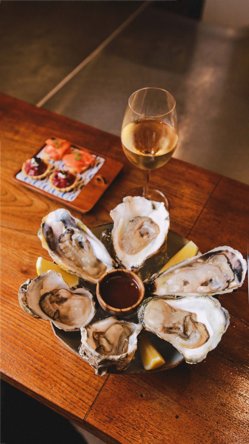 Platter of fresh oysters on ice served at Bonito's seafood restaurant in Seminyak